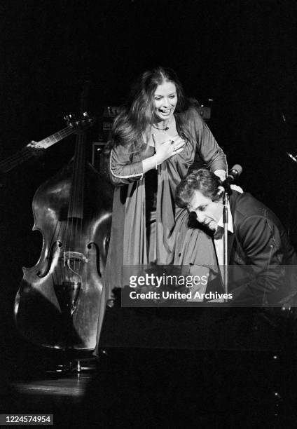 American country singer and song writer Johnny Cash and his wife June Carter Cash performing at Hamburg, Germany, circa 1981.