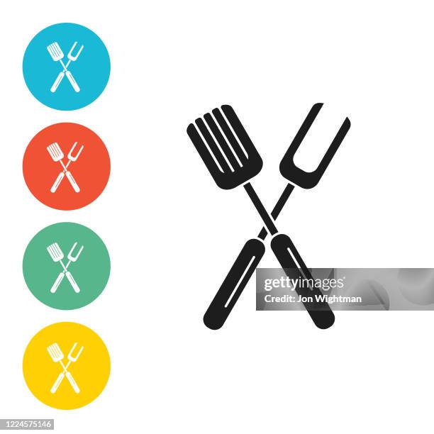 bbq fork and spatula icons on circle bases - grilling fork isolated stock illustrations