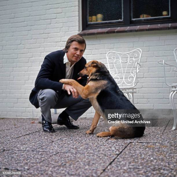 Austrian actor Karlheinz Boehm and his dog, Germany, 1960s.