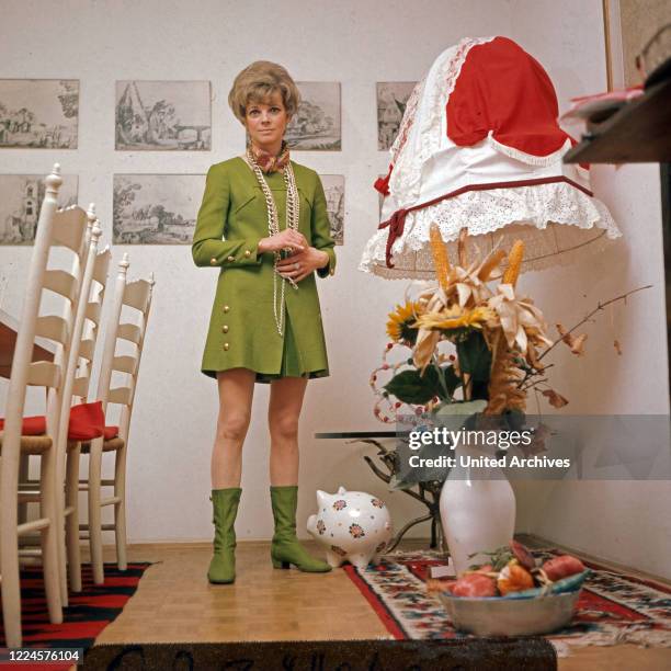 German actress Grit Boettcher in the living room, Germany, 1960s.