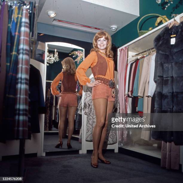Austrian actress Monika Strauch at a clothes shop, Germany, 1970s.