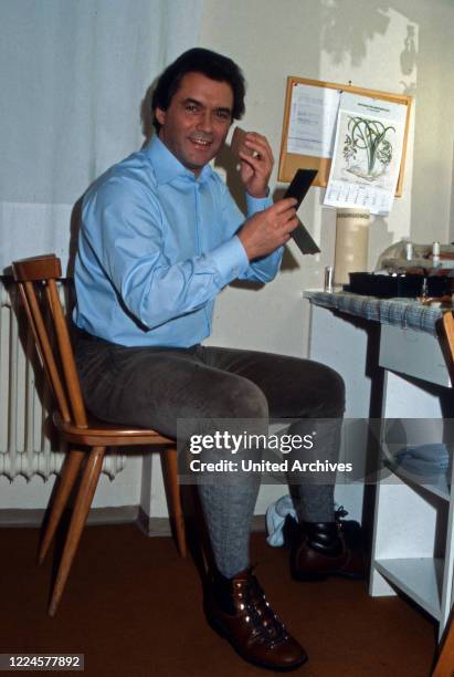 German actor Hans Juergen Baeumler at his wardrobe, Germany, 1980s.