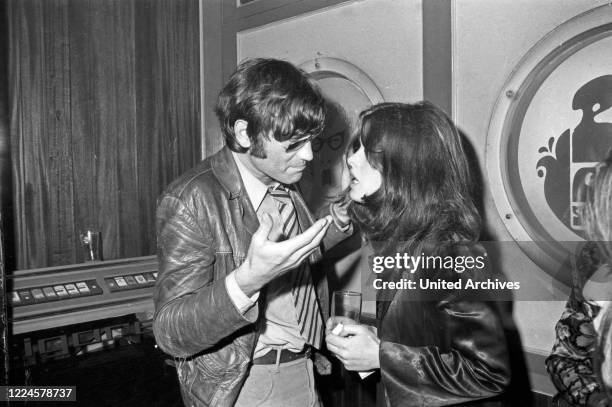 German movie director Rudolf Thome and photo model Uschi Obermaier in Club Schwabing in Munich, Germany, 1968.