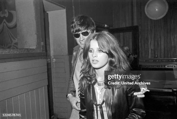 German movie director Rudolf Thome and photo model Uschi Obermaier in Club Schwabing in Munich, Germany, 1968.