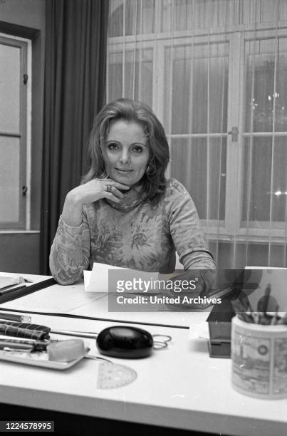 German Swiss actress Ruth Maria Kubitschek on her desk, Germany, 1960s.