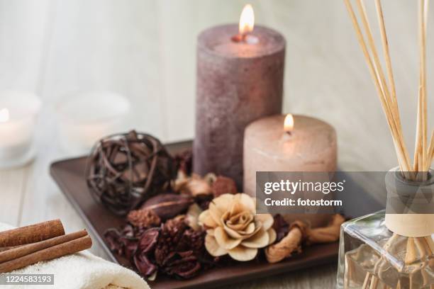 candles lit and aromas spreading to have a mindfulness meditation - scented candle stock pictures, royalty-free photos & images