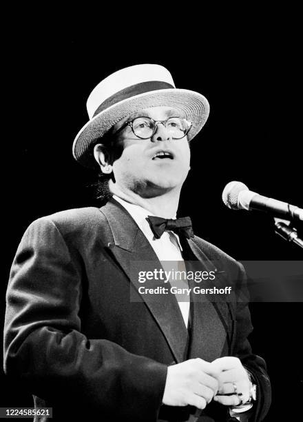 English Pop musician Elton John speaks onstage during the Third Annual Rock and Roll Hall of Fame Awards ceremony at the Waldorf Astoria Hotel, New...