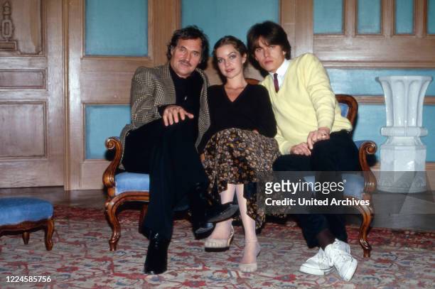 Actors Harald Leipnitz , Dietlinde Turban and Alfon Haiser on a sofa, Germany, 1980s.