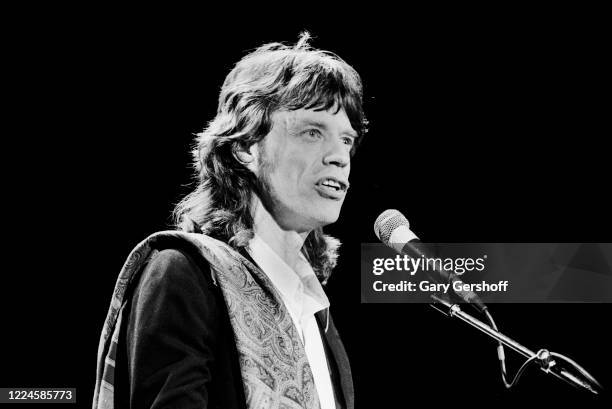 English Rock musician Mick Jagger, of the Rolling Stones, speaks onstage during the Third Annual Rock and Roll Hall of Fame Awards ceremony at the...