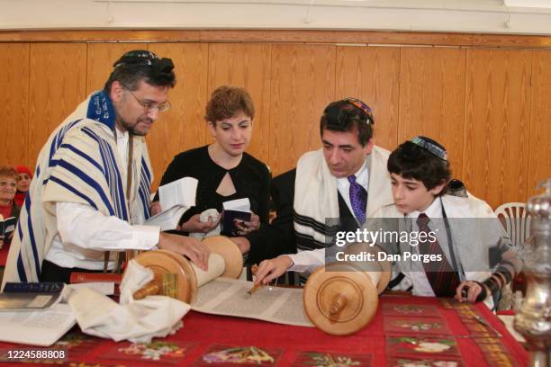 Bar Mitzvah, the ceremony which marks manhood for a Jewish boy, 13 years old, taking place at a Jerusalem synagogue where men and women worship...