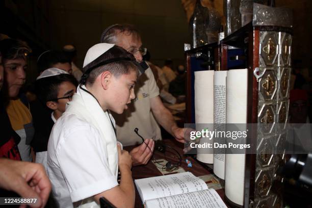 Bar Mitzvah, the ceremony which marks manhood for a Jewish boy, 13 years old, taking place at the Western or Wailing Wall in Old Jerusalem, the boy...