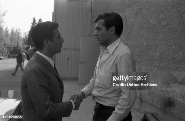 German movie director and producer Michael Pfleghar with French singer Gilbert Becaud, Germany, 1960s.