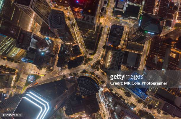 aerial view singapore city buildings in business district at night,financial economy, construction industry,or modern company organization concept - high street banks stock pictures, royalty-free photos & images