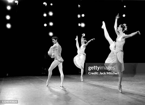 Portrait of dancers Bart Cook, Allegra Kent, and Lordes Lopez, all of the New York City Ballet, as they perform during a production of 'La...
