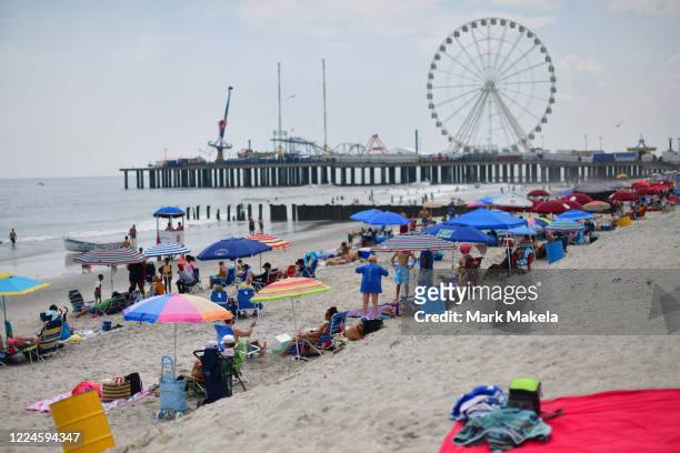 People visit the beach on July 3, 2020 in Atlantic City, New Jersey. New Jersey beaches have reopened for the July 4th holiday as some coronavirus...