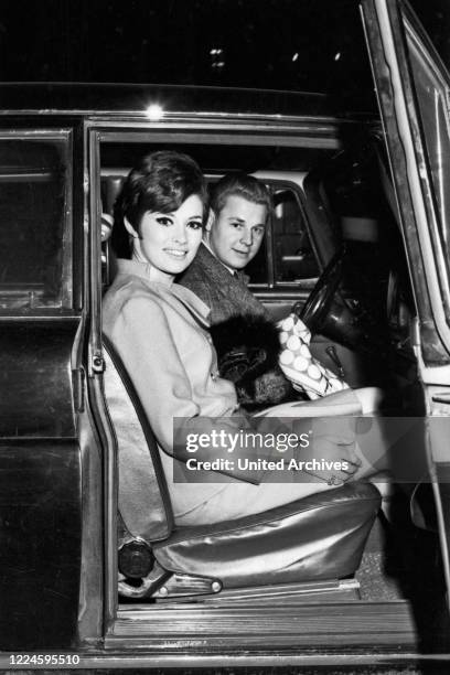 Canadian actress Beverly Adams and driver Otto Maurer at Munich, Germany, 1960s.