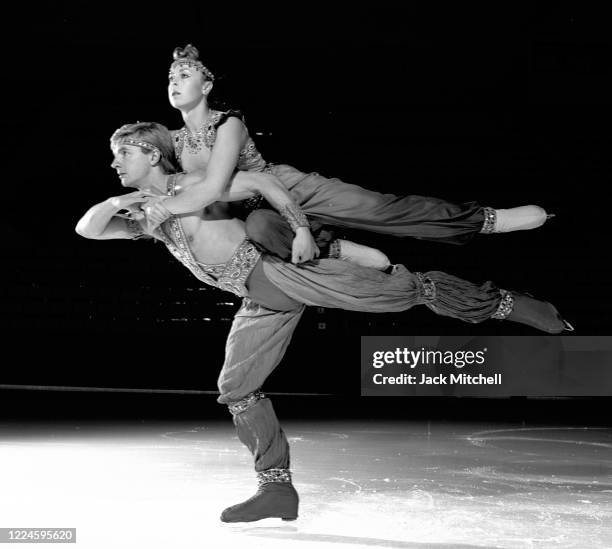 Portrait of English figure skating duo Jayne Torvill and Christopher Dean as they perform on ice, November 1986. The pair were the 1984 Olympic gold...