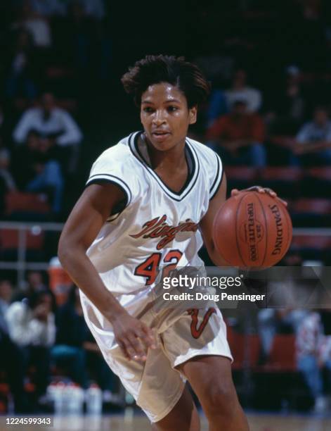 Charleata Beale, Forward for the University of Virginia Cavaliers dribbles with the ball during the NCAA Atlantic Coast Conference college...