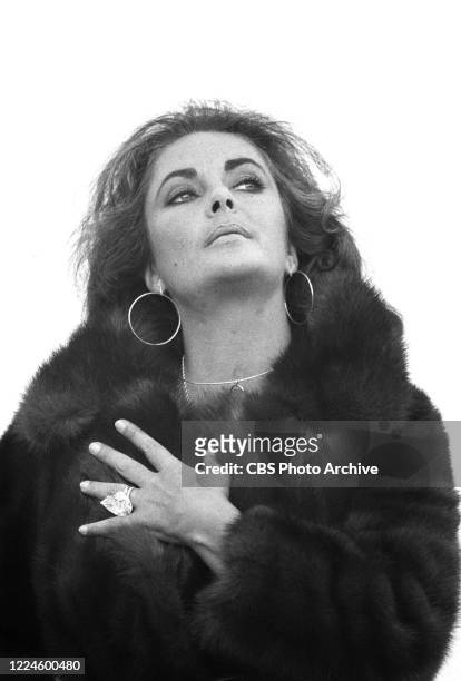 Actress Elizabeth Taylor displays her ring during her interview with CBS teleivion's "60 Minutes" on March 13, 1970.
