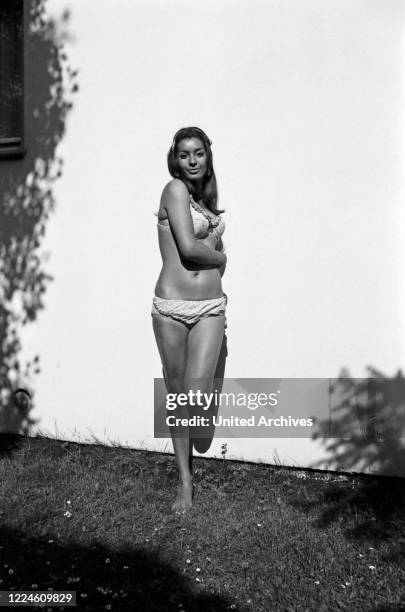 Photo model Marielle doing a photo shoot wearing swimsuit, Germany, 1960s.