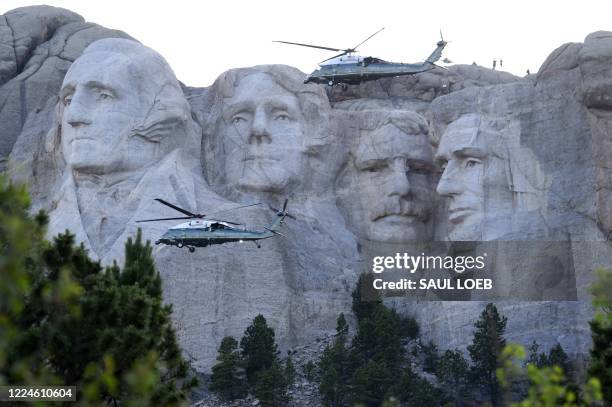 Marine One flies past Mount Rushmore National Monument in Keystone, South Dakota, July 3 as the US president arrives to view Independence Day...