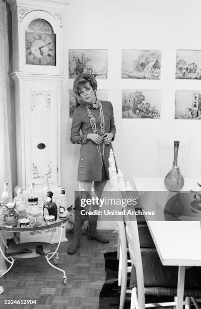 German actress Grit Boettcher in the living room, Germany, 1960s.