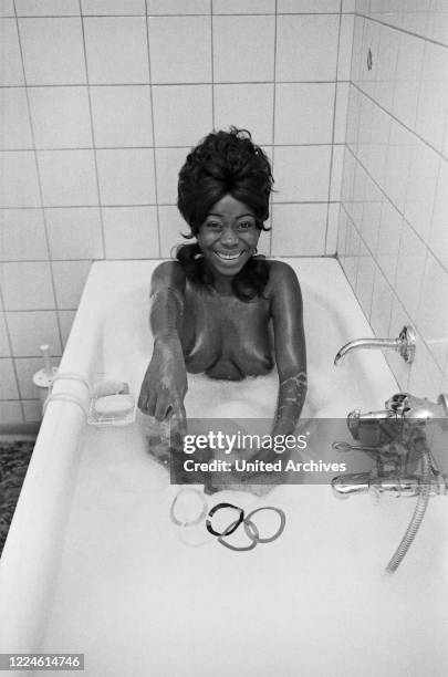 Olympic cramps , photo series with Marianna Barry in the bathroom, Germany, 1970s.