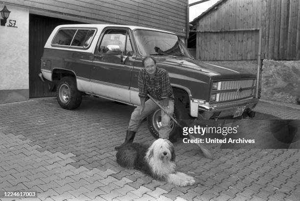 German actor Til Erwig with his Chevrolet Blazer van, Germany, 1980s.