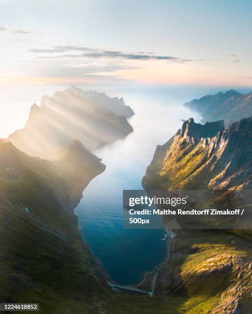 aerial view of fjord and mountains at sunrise, senja, troms county, norway - fjord stock pictures, royalty-free photos & images