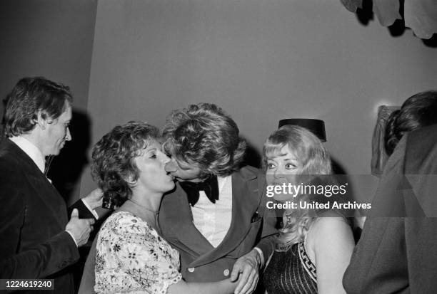 Dutch entertainer Rudi Carrell with actress Margot Mahler at the Deutscher Filmball 1974 at Munich, Germany, 1970s.