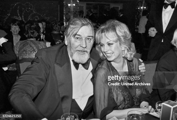 German movie director Bernhard Wicki and Barbara Valentin at the Deutscher Filmball on January 15th 1979 at Munich, Germany, 1970s.