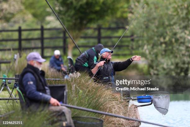 Anglers fish at Acorn Fisheries on May 13, 2020 in Kingston Seymour, Somerset, England . The prime minister announced the general contours of a...