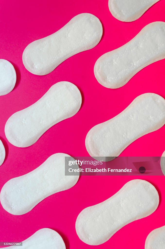 Sanitary Pads Over Pink Background