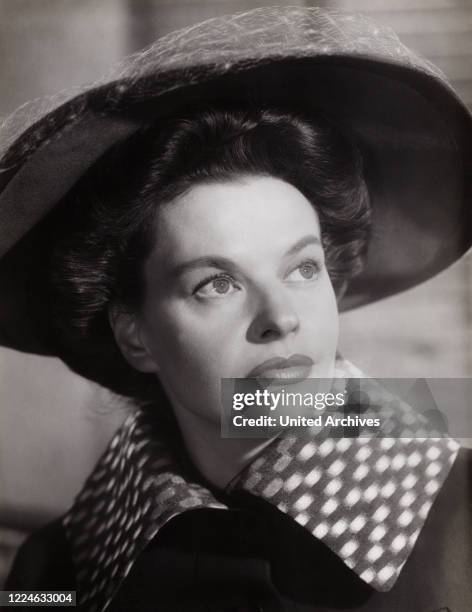 German schlager singer and actress Margot Hielscher in a bts shot of the movie "Anastasia - Die letzte Zarentochter", Germany, 1956. .