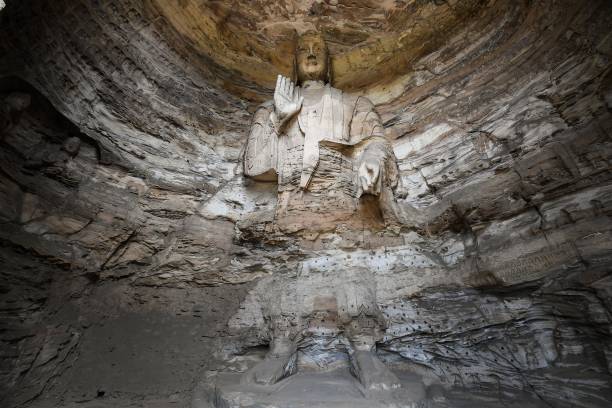 Whispers of the Past in the Echoing Halls of Yungang Grottoes 6 Buddha statue at Yungang Grottoes