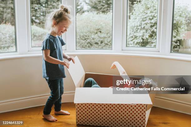 Hiding In Box Child Hiding In Box Photos and Premium High Res Pictures - Getty Images
