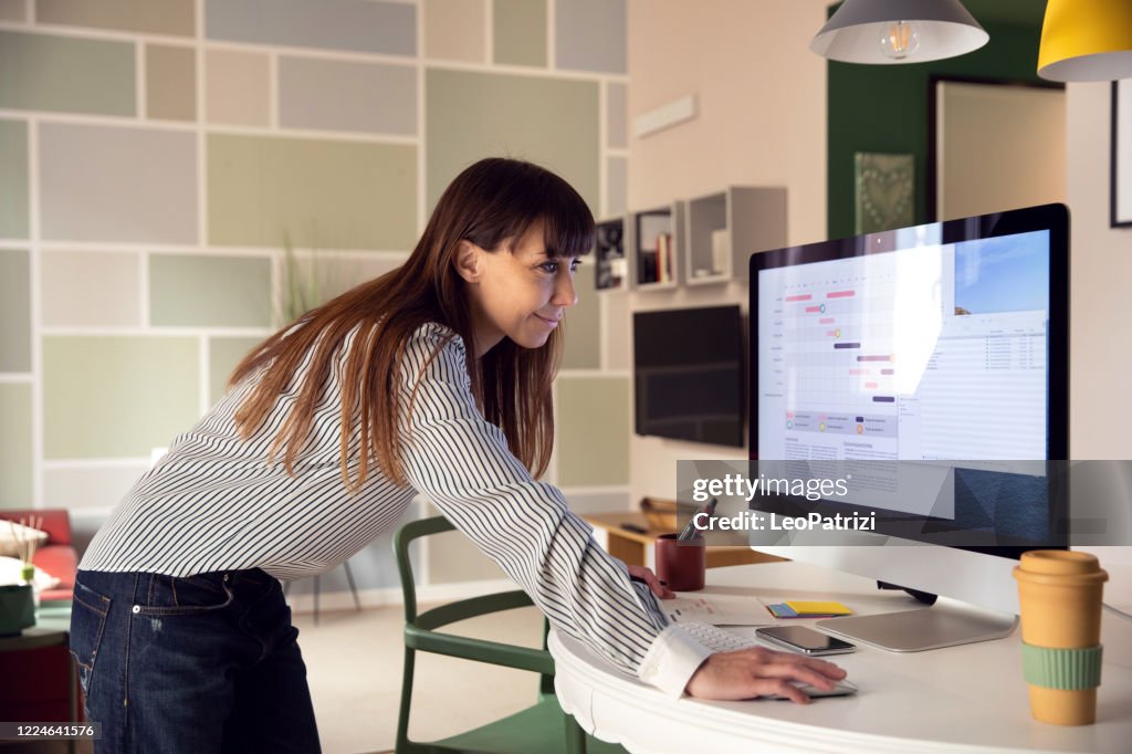 Adult woman planning the weekly business schedule