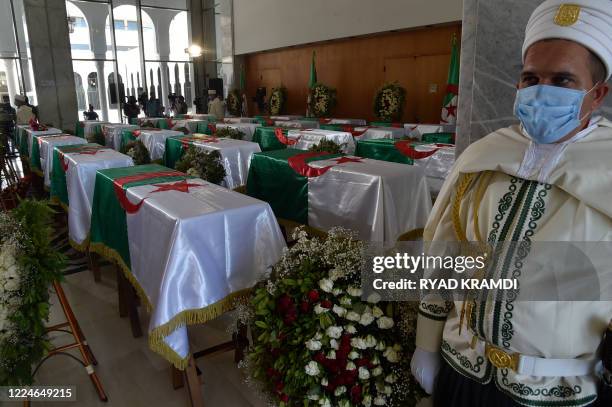 The national flag-draped coffins containing the remains of 24 Algerian resistance fighters decapitated during the French colonial conquest of the...