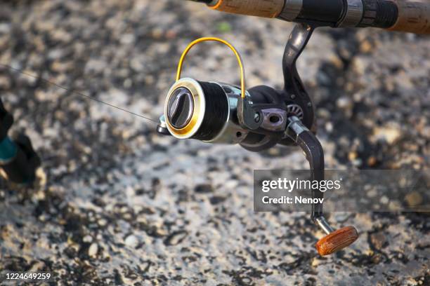 image of fishing rod with modern reel - sedal fotografías e imágenes de stock