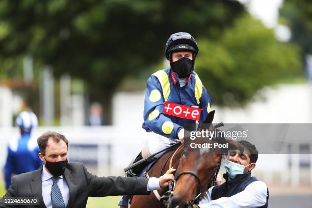 Jockey Martin Dwyer onboard Jack's Point ahead of the Investec Surrey Stakes at Epsom Racecourse on July 04, 2020 in Epsom, England. The famous race...