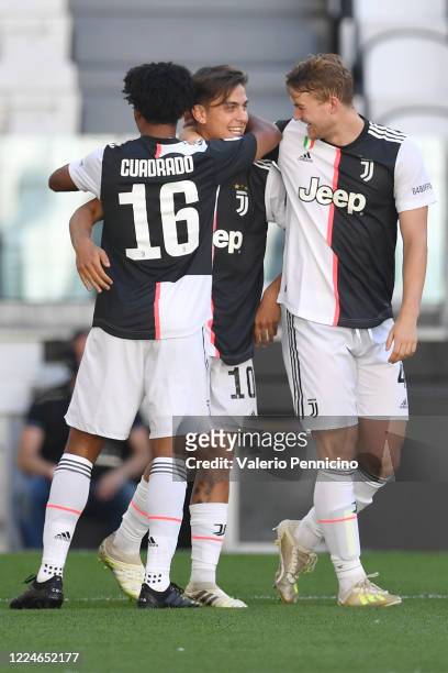 Paulo Dybala of Juventus celebrates the opening goal with team mates Juan Cuadrado and Matthijs de Ligt during the Serie A match between Juventus and...