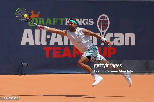 Tennys Sandgren of the United States returns a ball during the singles match against Christopher Eubanks of the United States during the DraftKings...