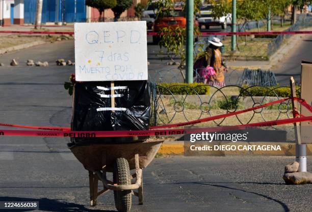 View of an empty coffin placed by relatives of a victim of COVID-19 who died a week ago to protest for not being able to bury him, in Cochabamba,...