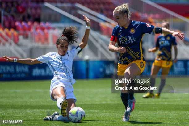 Estelle Johnson of Sky Blue FC slides into Amy Rodriguez of Utah Royals FC during a game on day 4 of the NWSL Challenge Cup at Zions Bank Stadium on...