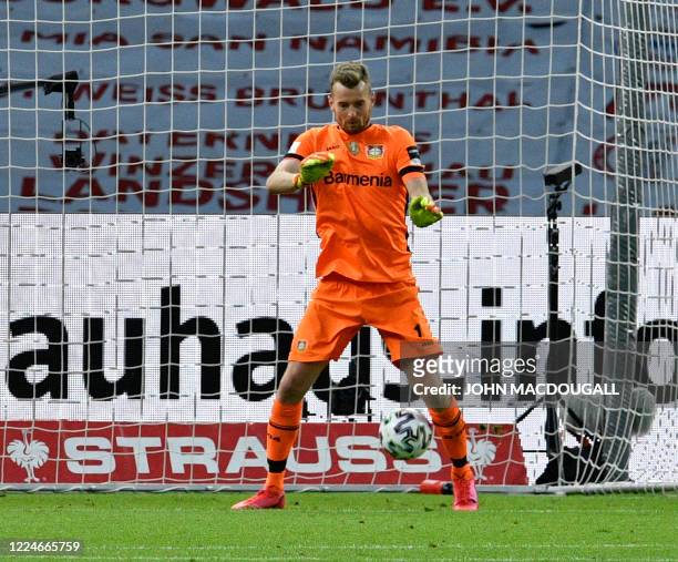 Leverkusen's Finnish goalkeeper Lukas Hradecky fails a save and lets the ball ending between his legs conceding the third goal for Bayern Munich...