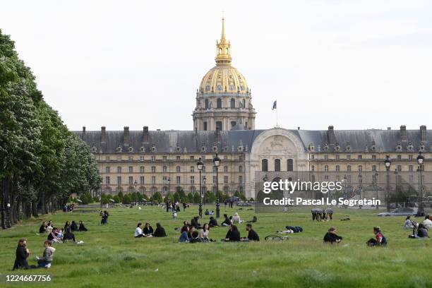 Parisians gather at les Invalides as France is slowly reopening after almost two months of strict lockdown throughout the country due to the epidemic...