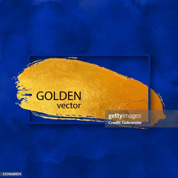 blue frame with golden brush stroke on watercolor blue background. gold shiny grunge texture. gold foil brush stroke clip art. gold paint blot isolated. metallic golden texture design element for greeting cards and labels, abstract background. - dark blue watercolor stock illustrations