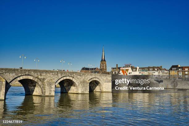 the meuse river at maastricht, the netherlands - maastricht stock pictures, royalty-free photos & images