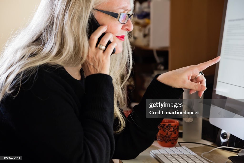 Stylish 50+ woman working from home.