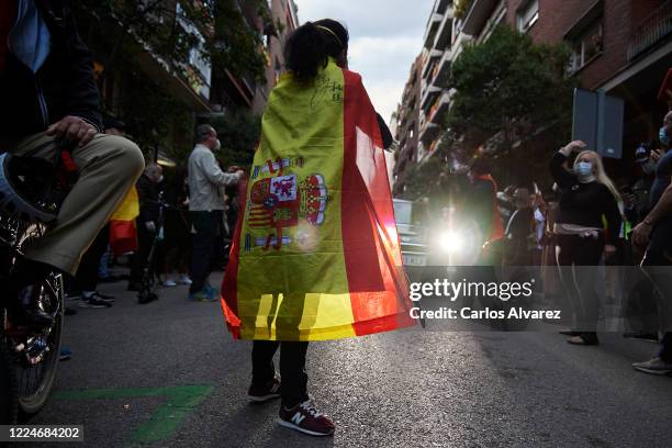 Groups of people participate with Spanish flags, hitting saucepans and shouts calling for the resignation of the government and against the...